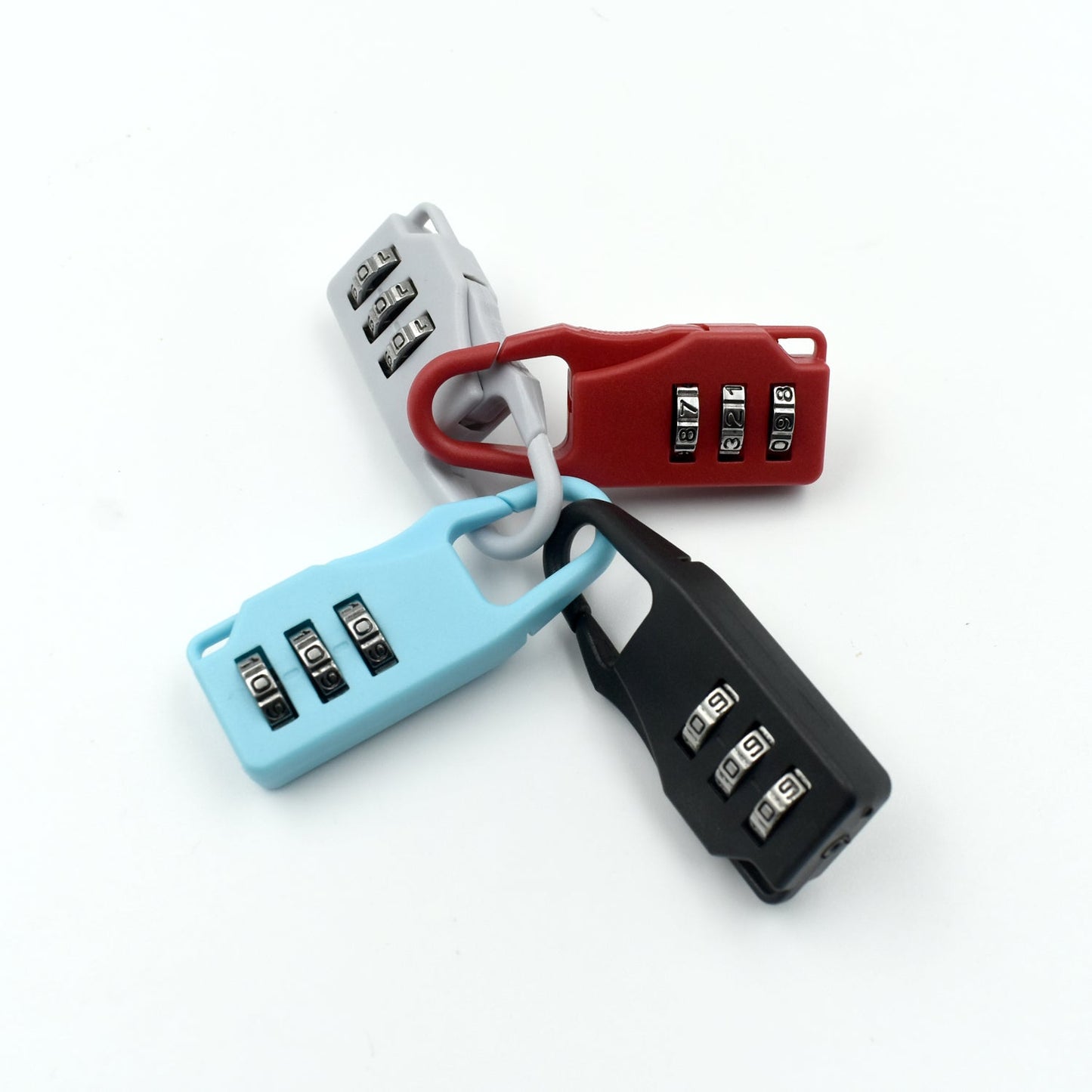 Set of three 3 digit luggage locks in red, blue, and black for secure travel protection