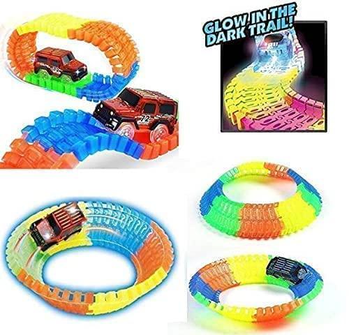 Colorful magic bendable race tracks with a glowing effect and toy cars racing on them