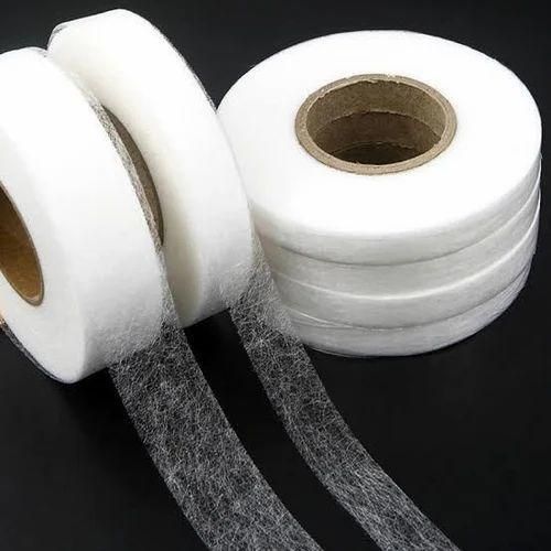 Three rolls of adhesive fabric fusion tape in different widths for sewing and crafting projects
