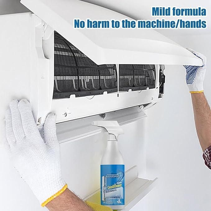 Person cleaning air conditioner unit with air conditioner cleaner spray bottle placed on shelf
