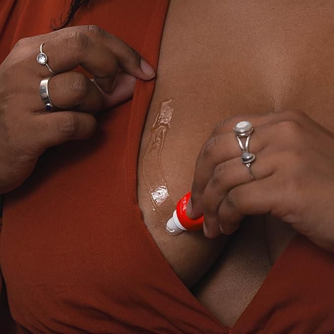 Applying sensitive skin body glue on chest for secure adhesive hold by The Gir Farmer
