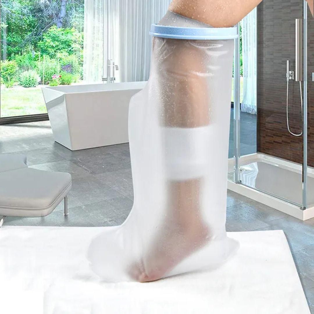 reusable cast cover for leg injury waterproof knee high protective sleeve with blue seal in bathroom setting