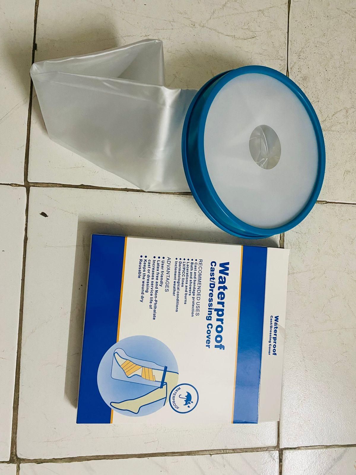 THE GIR FARMER waterproof reusable cast cover for leg injury with blue rim and clear plastic sleeve
