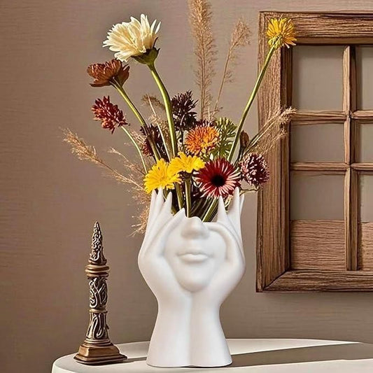 Artistic hand face vase for home decor featuring colorful flowers and a modern design