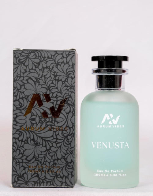 Venusta perfume 100ml bottle with frosted glass and black cap next to decorative black and gray floral patterned box