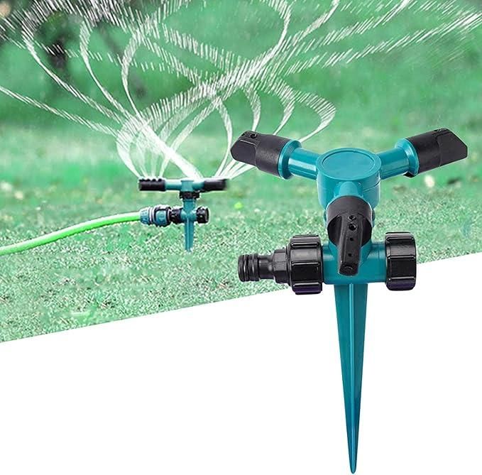THE GIR FARMER automatic rotating yard sprinkler in blue spraying water over green grass lawn
