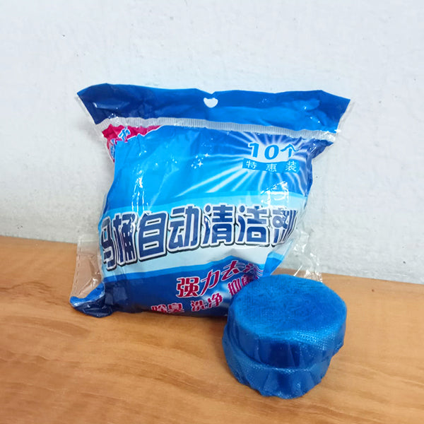 Amd-Deodap blue automatic toilet bowl cleaner tablets package with one tablet on wooden surface