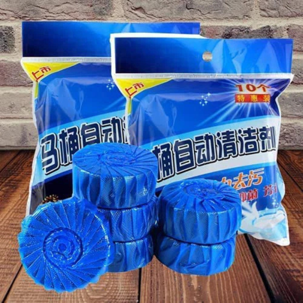 Amd-Deodap automatic toilet bowl cleaner tablets stacked in blue packaging on wooden surface
