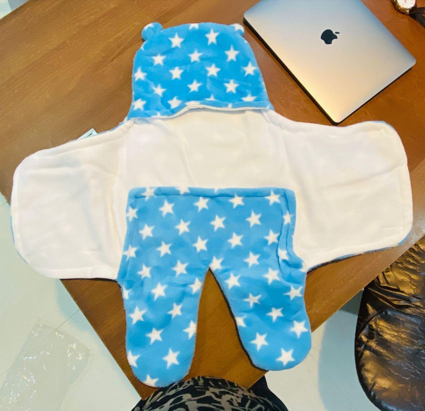 Cozy blue baby wearable blanket with star pattern and attached hood for warmth and comfort