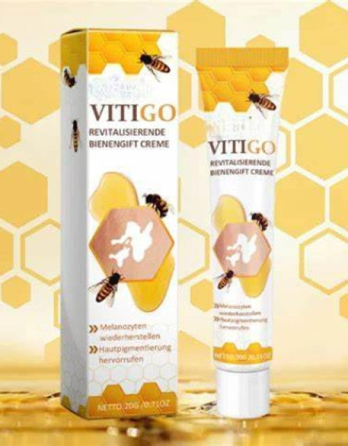 The Gir Farmer bee venom vitiligo cream packaging and tube with honeycomb design and bee illustrations