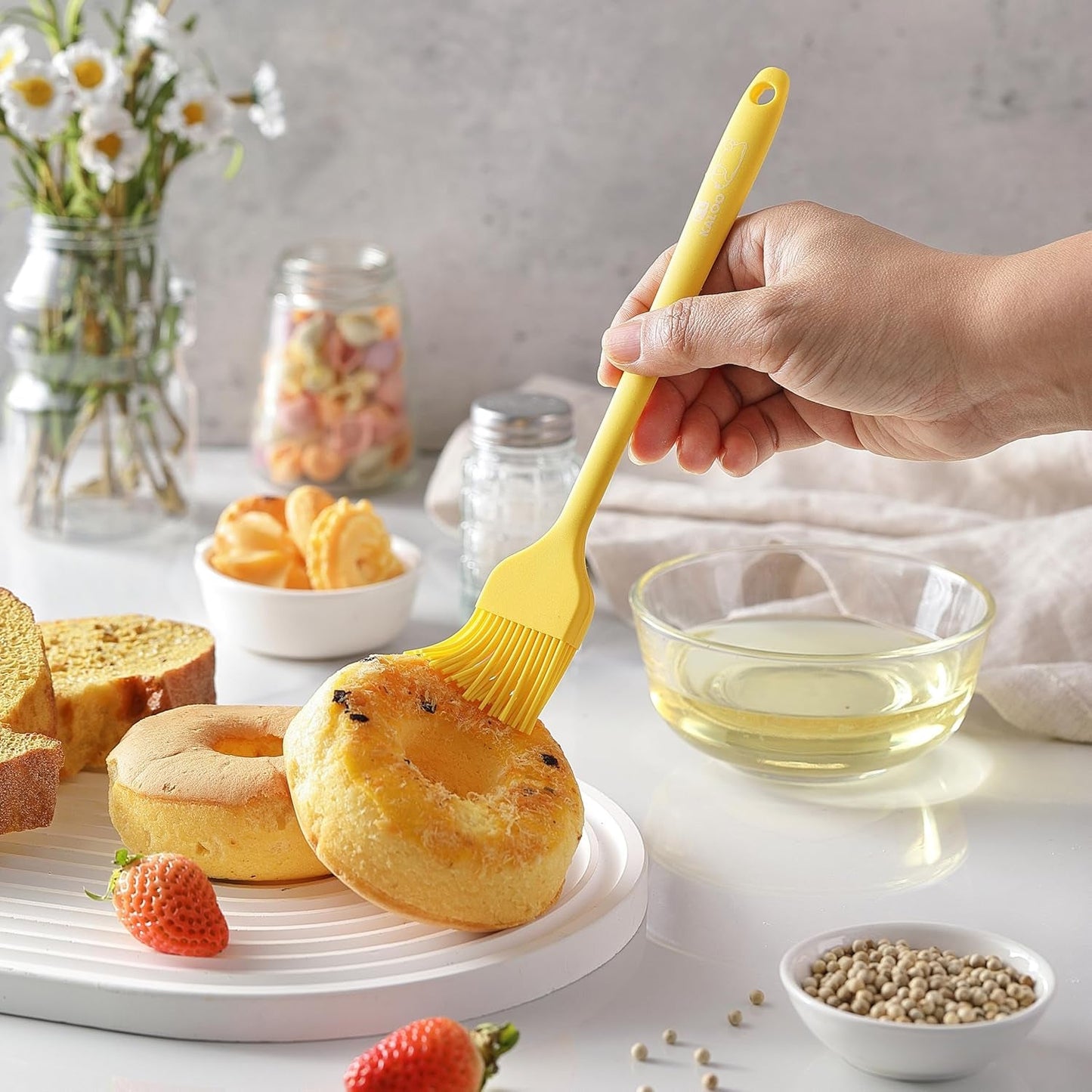 Yellow oil brush applying glaze on baked goods best baking basting brush for kitchen use