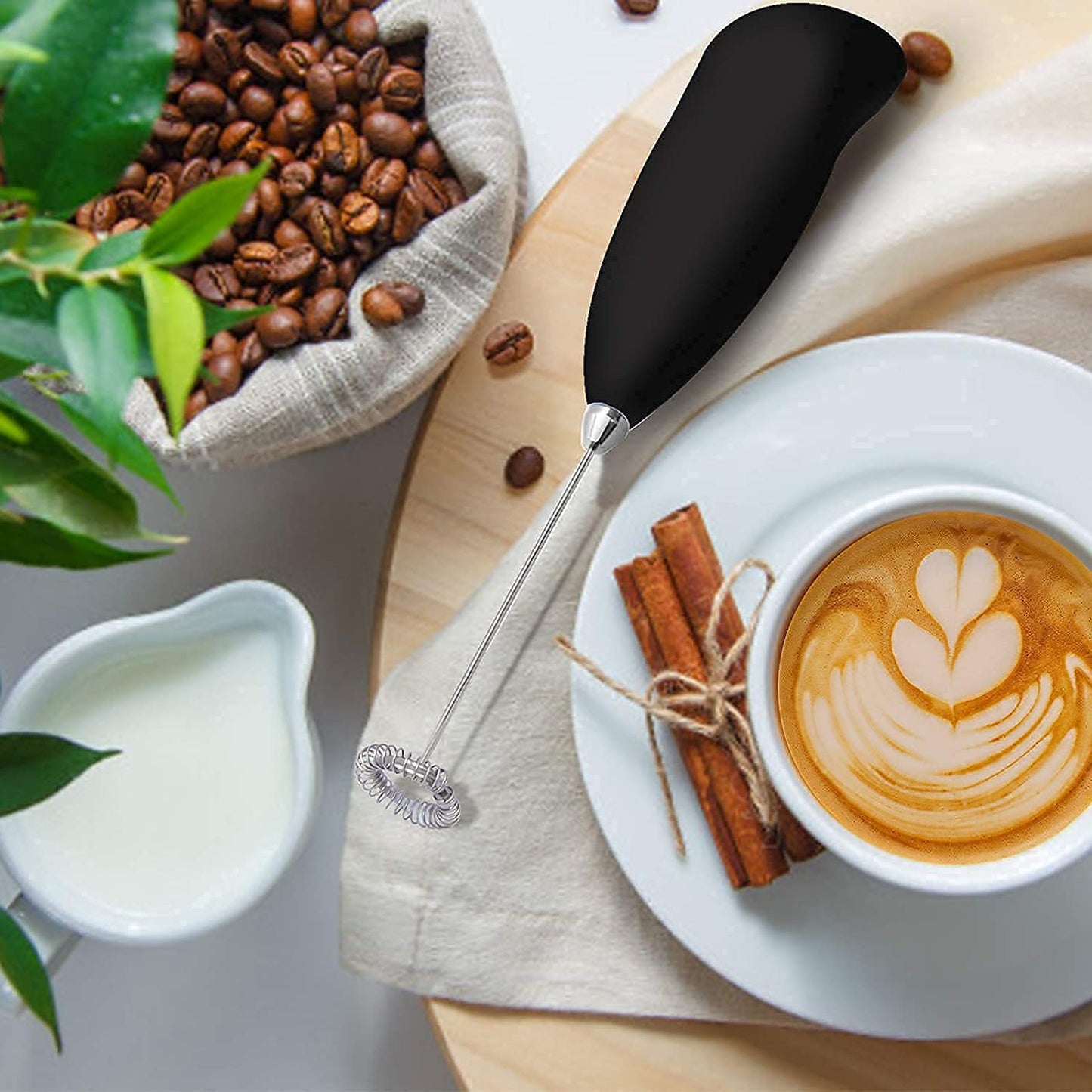 THE GIR FARMER hand blender with black handle best hand blender for frothy coffee next to a cup of latte and coffee beans