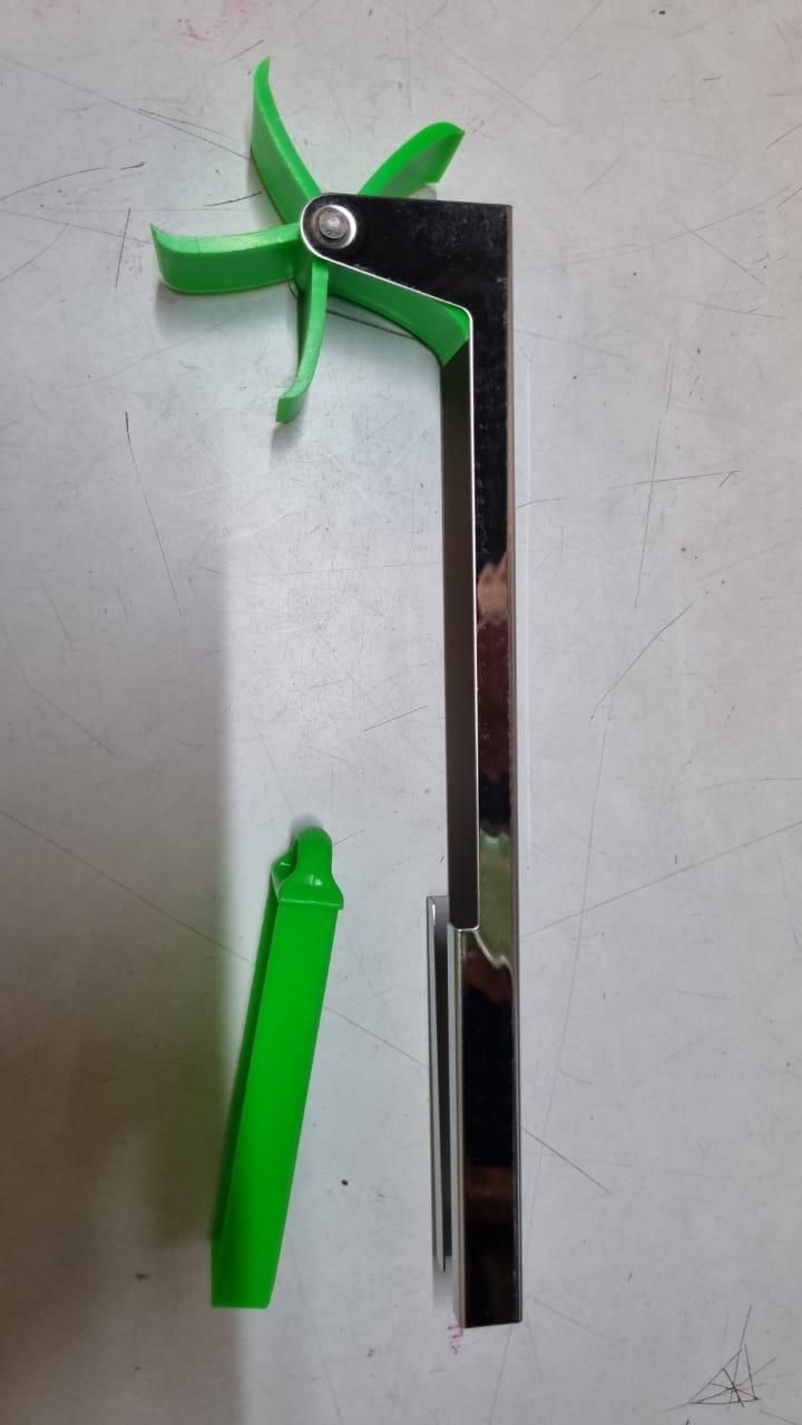 The Gir Farmer green and stainless steel tool designed as the best tool for slicing watermelon easily