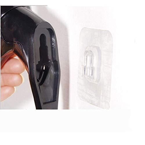 The Gir Farmer self adhesive coat hook holding a black object on a white wall