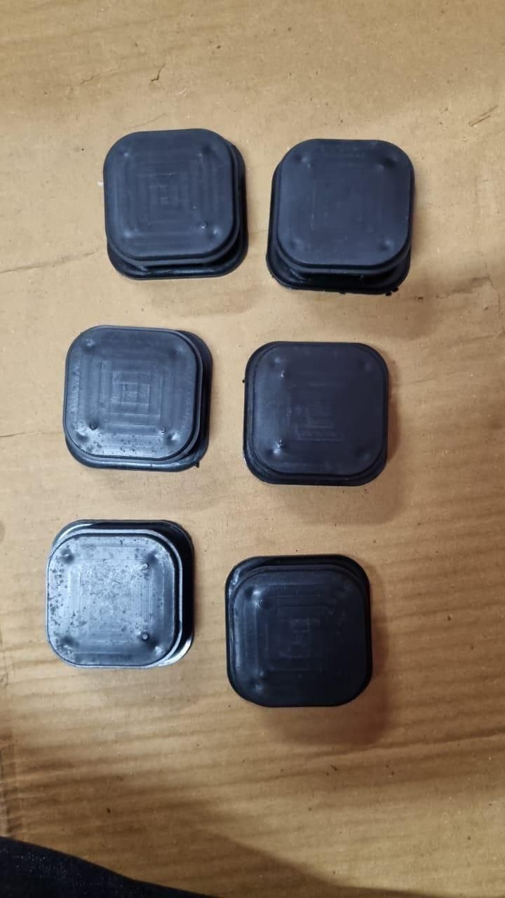 The Gir Farmer black anti cockroach bait station containers arranged on a wooden surface