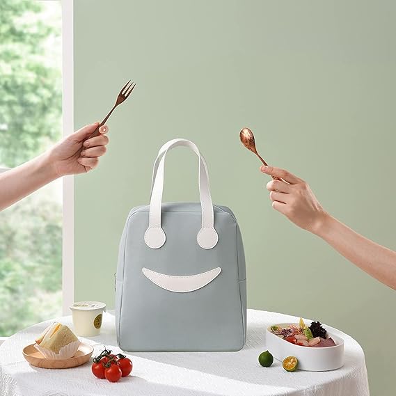 THE GIR FARMER large insulated lunch bag in light gray with white handles on a table with food and utensils