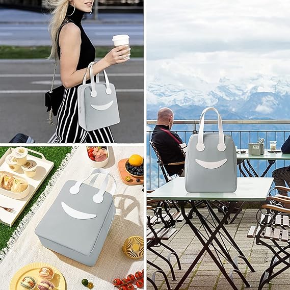 Large insulated lunch bag by THE GIR FARMER in light gray with smiling face design and white handles