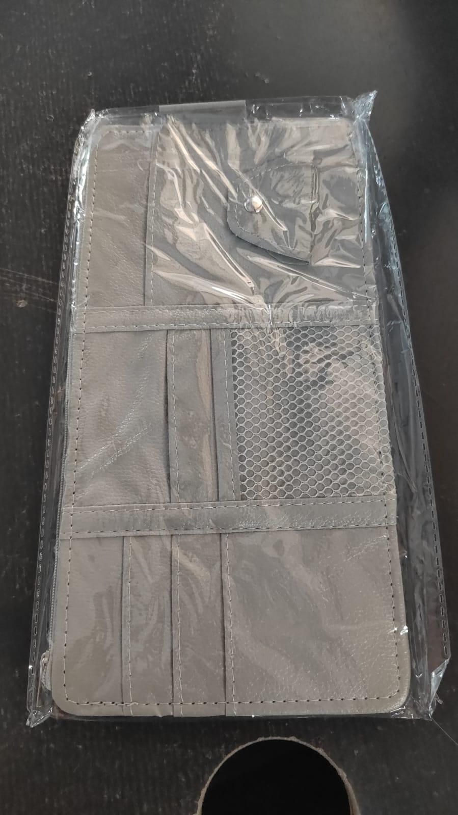 Car sun visor organizer in gray, packaged and ready for use in vehicles