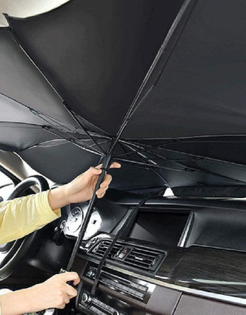 Dropdash car windshield sun shade umbrella being set up inside a vehicle for protection against UV rays