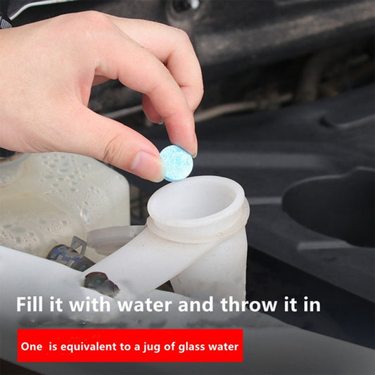 Car wiper detergent tablets being added to a water reservoir for effective windshield cleaning