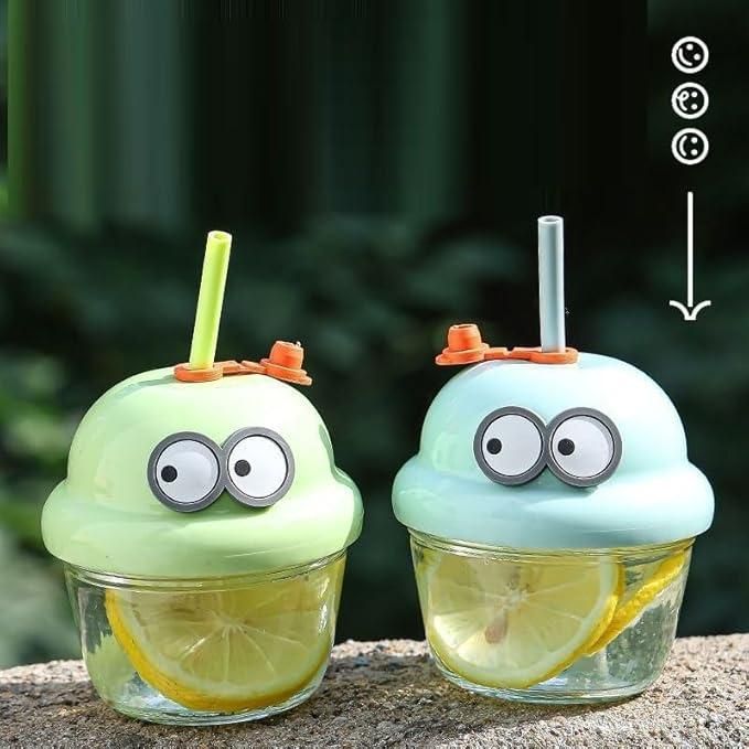 Fun cartoon glass cup for kids shaped like colorful cupcakes with straws and googly eyes