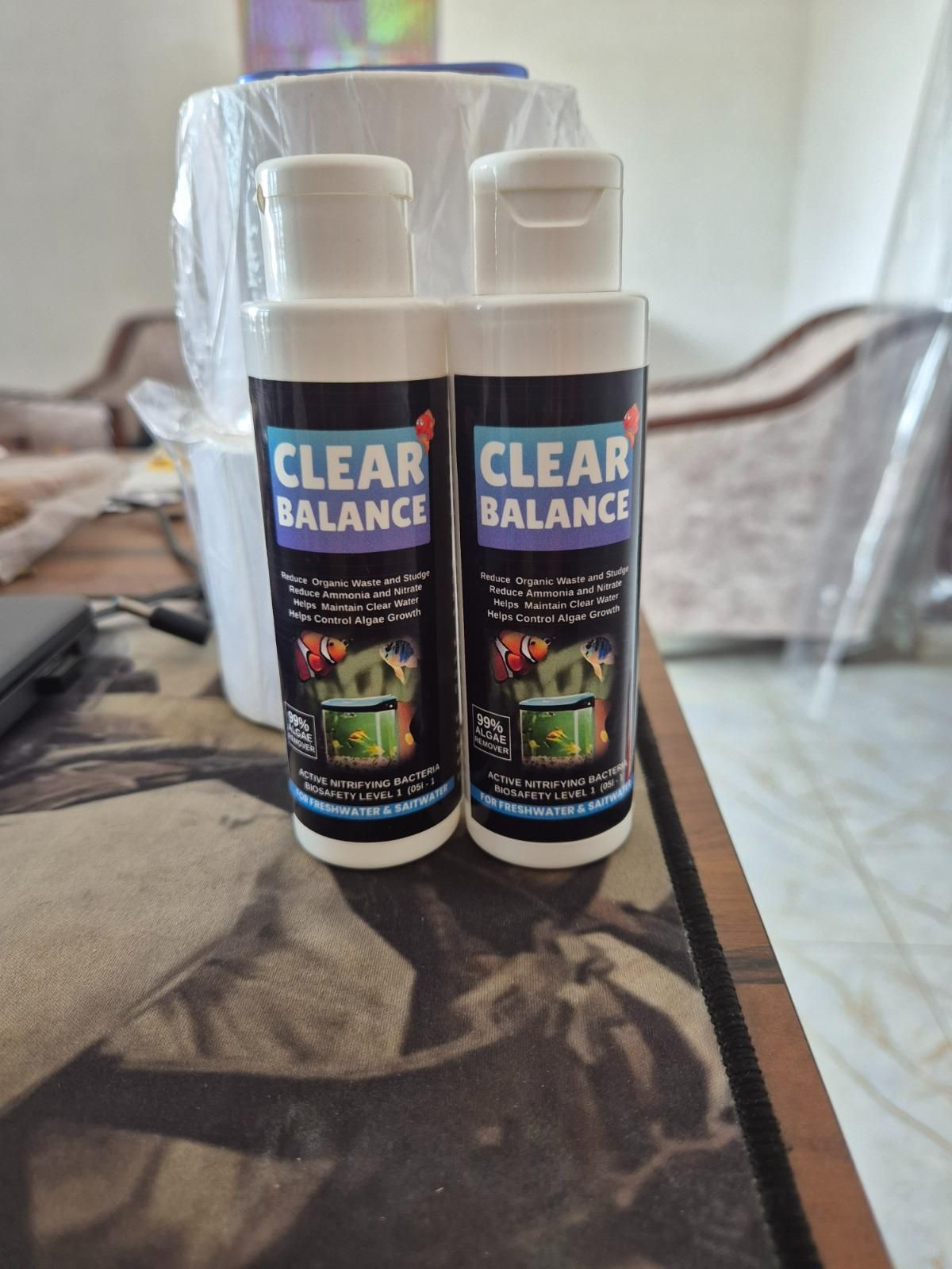 THE GIR FARMER Clear Balance aquarium water cleaner for freshwater and saltwater in two white bottles