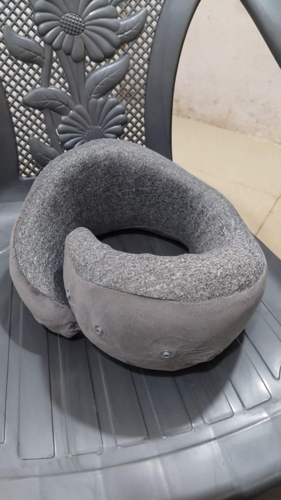 THE GIR FARMER grey U shaped memory foam travel neck pillow for adults with snap closure on chair