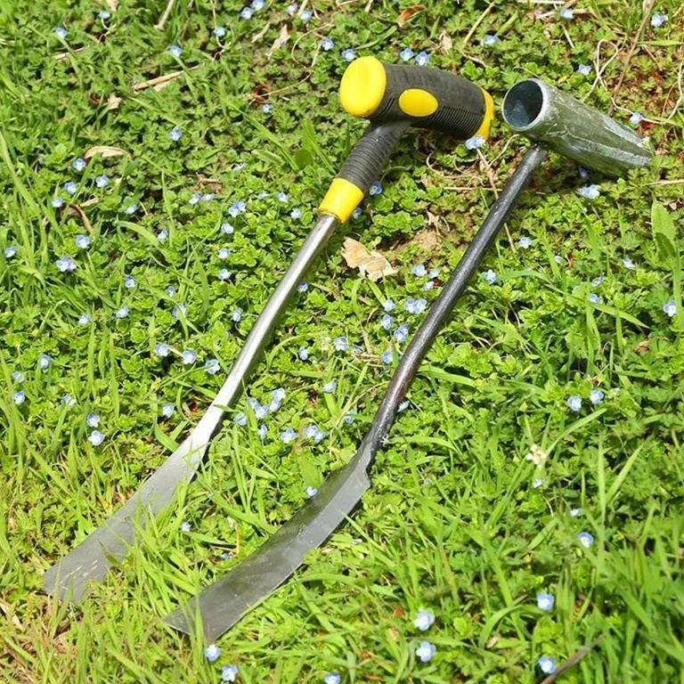 Two gardening tools including a compact shovel for planting and weeding on green grass