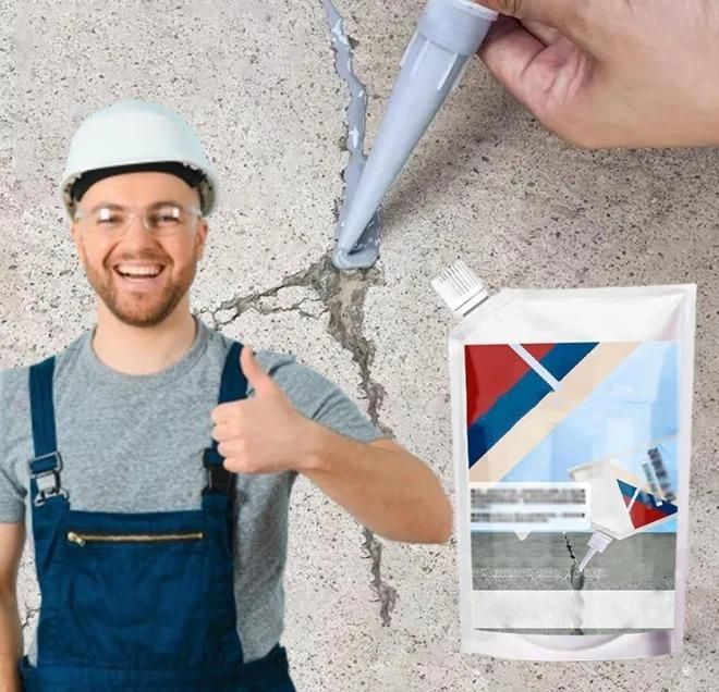 Worker giving thumbs up applying concrete crack repair adhesive to a cracked concrete surface with product pouch