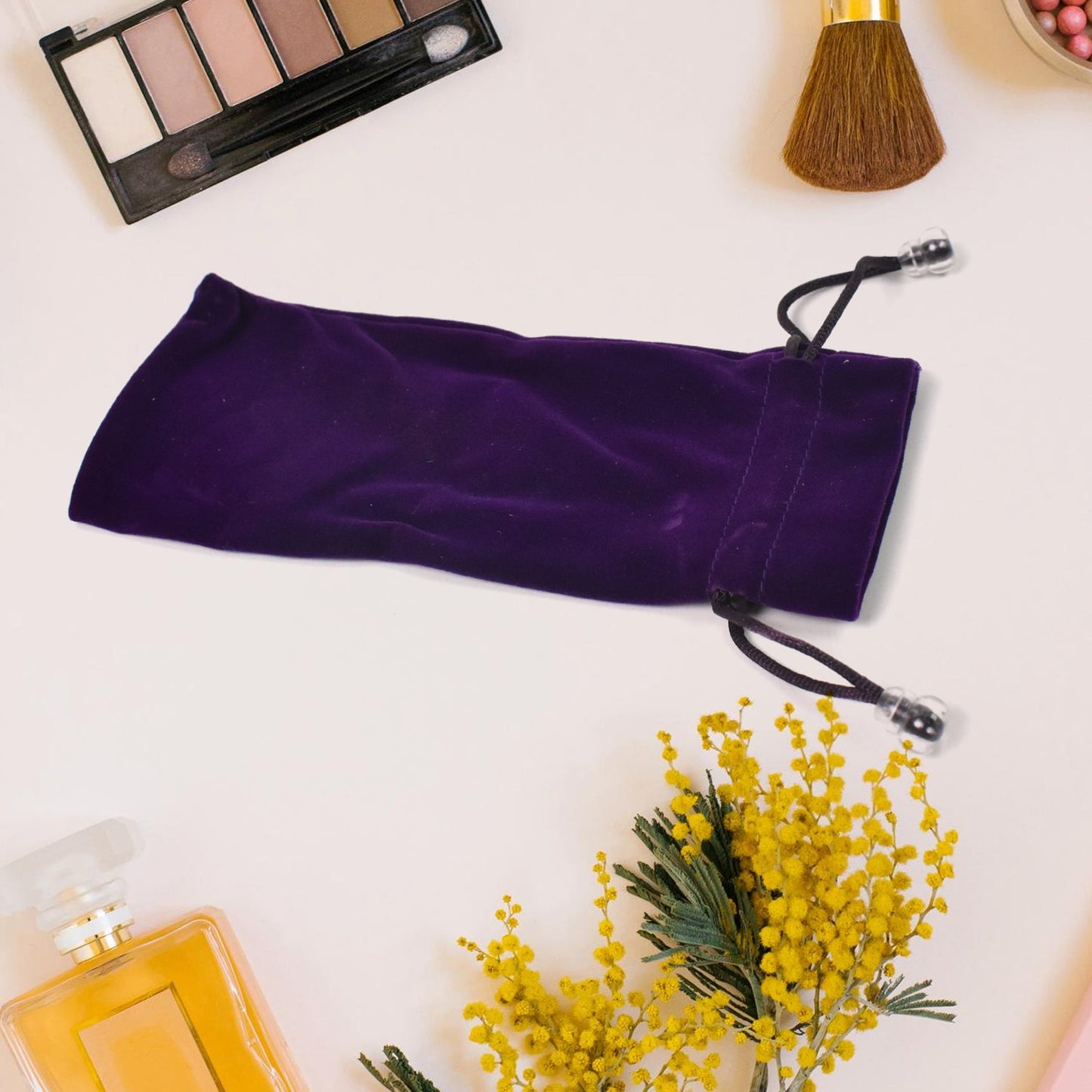 Small fancy return gift bags in purple velvet with drawstring closure for elegant gifting