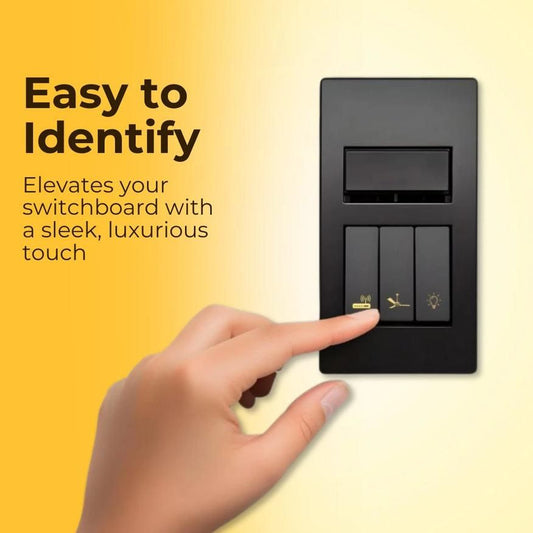 Hand pressing black light switch with decorative light switch stickers for easy identification