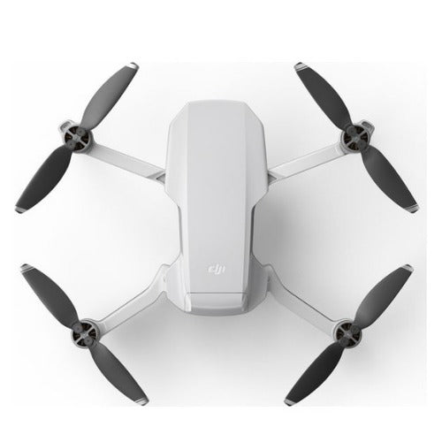 DJI Mini 2 SE drone combo in white with four propellers for aerial photography