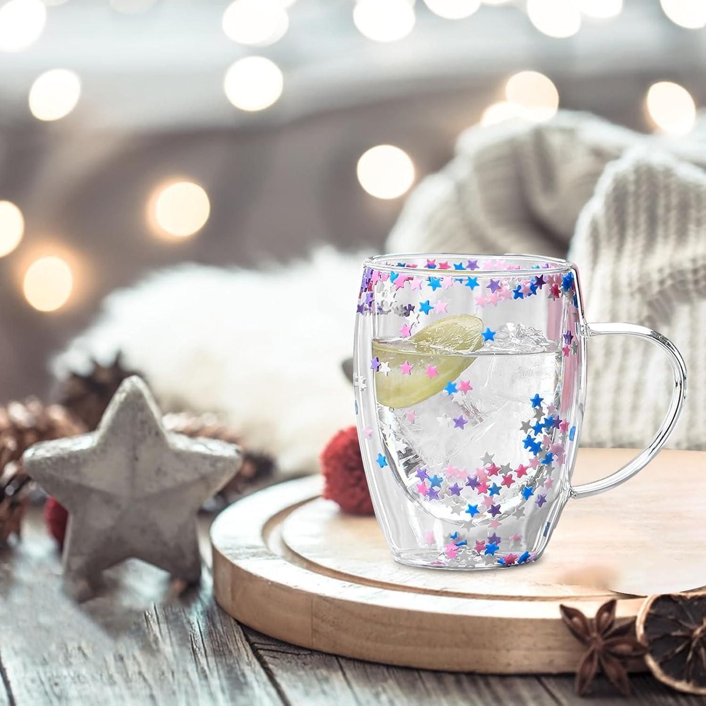 THE GIR FARMER double walled glass coffee mug with colorful star confetti design filled with ice and lime