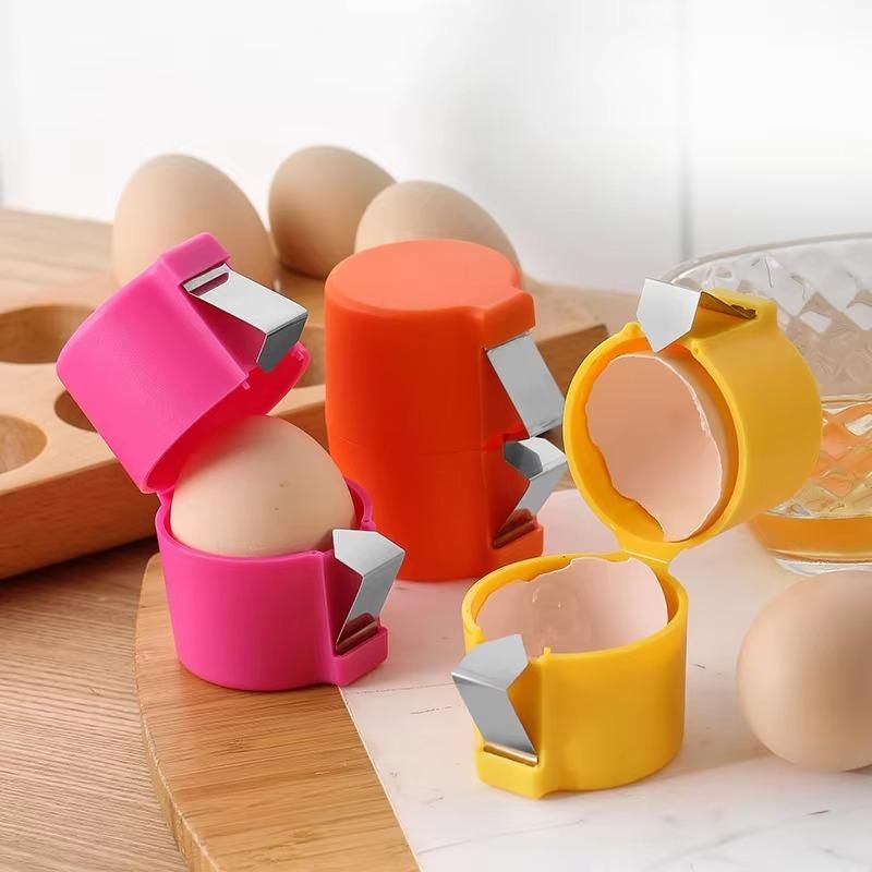 Colorful egg topper cutter tool set in pink orange and yellow cutting egg shells cleanly