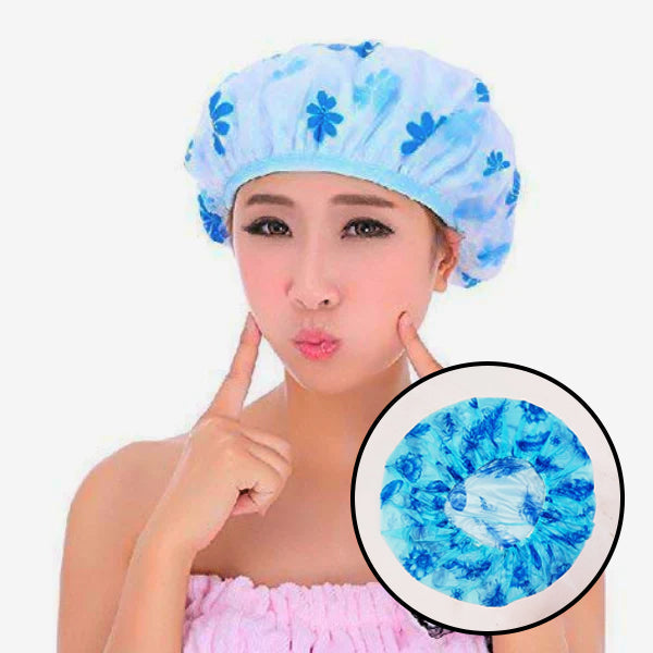 Blue floral elastic band shower cap for long hair worn by woman with clear skin