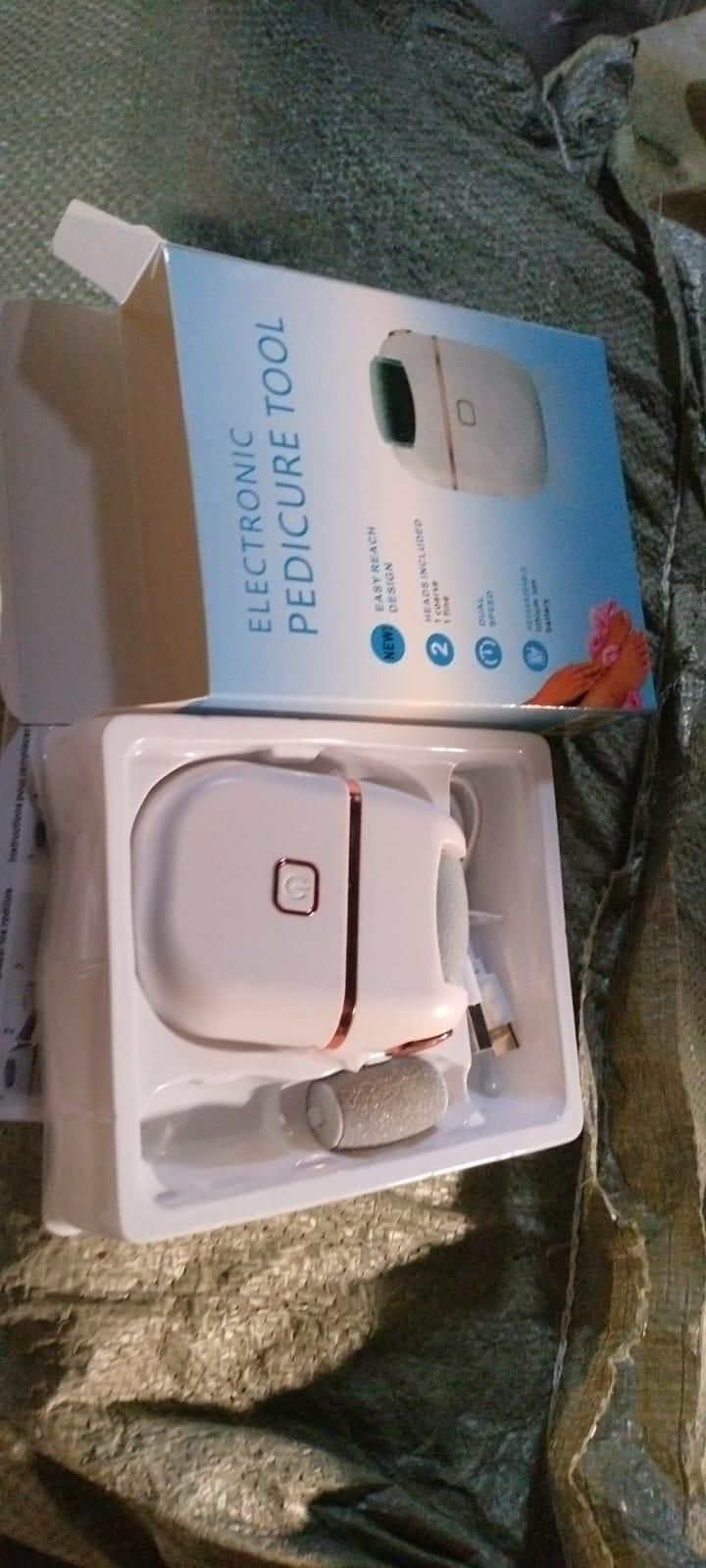 8feb97-4 electronic pedicure tool kit with device, pumice head, and USB charging cable in packaging