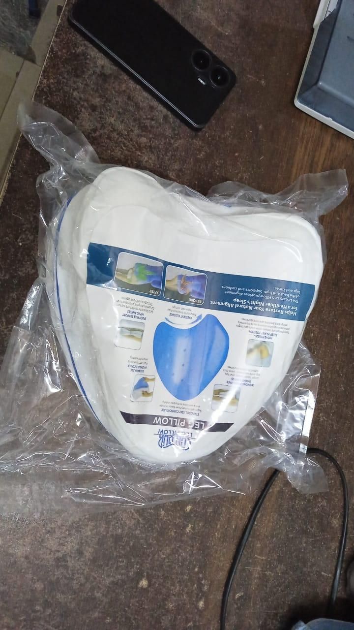 Ergonomic knee pillow for side sleepers packaged for comfortable support and alignment during sleep