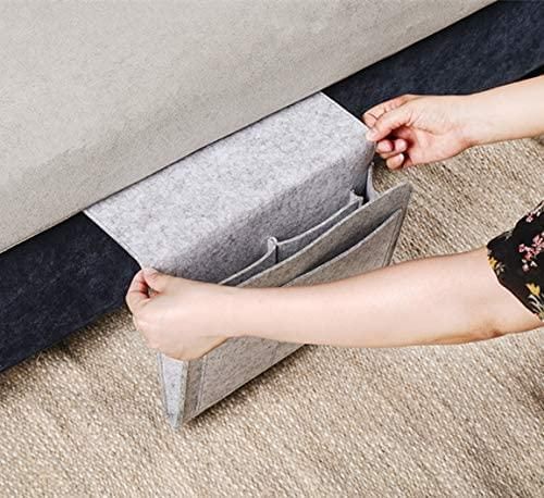 The Gir Farmer felt bedside pocket for essentials being attached to a bed frame for easy storage