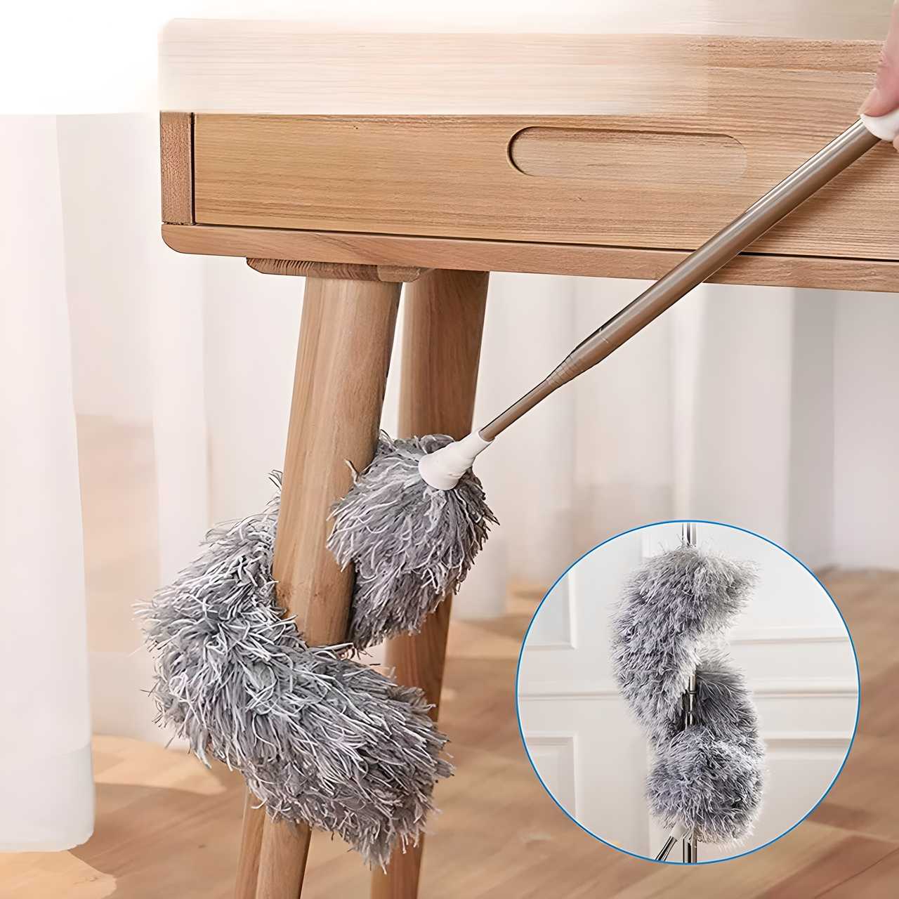 Flexible mop duster from THE GIR FARMER cleaning wooden table legs with soft gray microfiber fibers