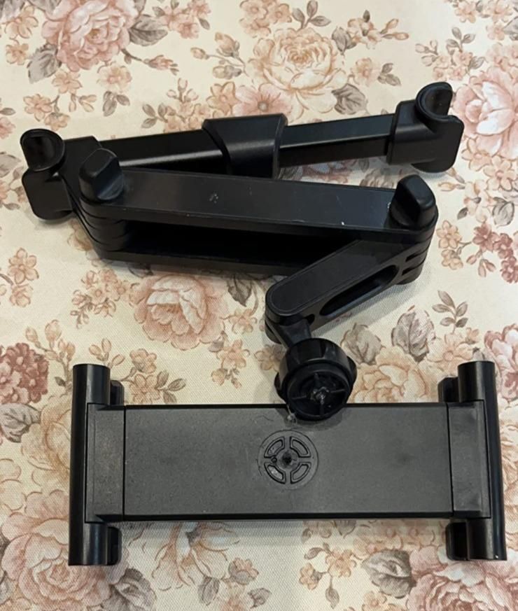 Black adjustable folding car mount holder for tablets and phones with extendable arms and rotating clamp