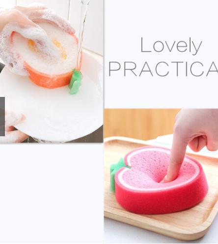 Fruit shaped cleaning sponge in orange and red used for washing dishes and cleaning surfaces