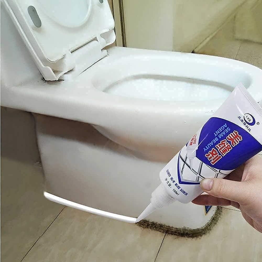 Applying gap filler tube for home repair to seal gap between toilet base and floor