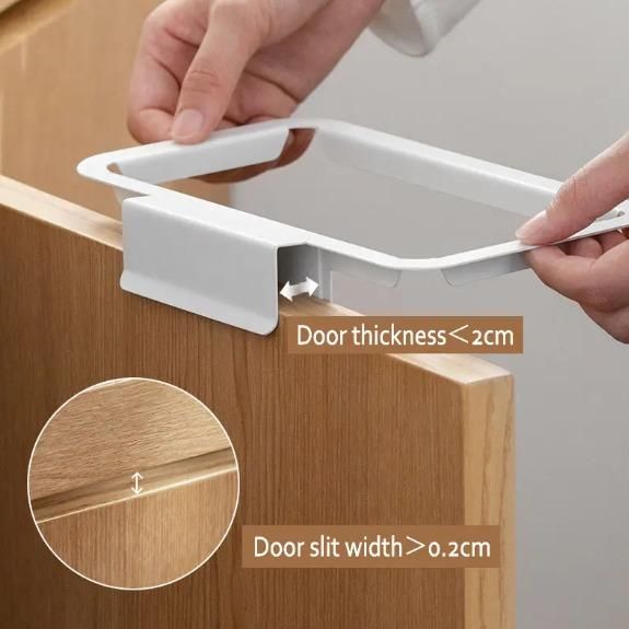 White attachable kitchen garbage bag holder being installed on a wooden cabinet door under 2cm thick