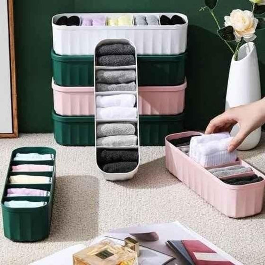 THE GIR FARMER drawer organizers for makeup in green, pink, and white holding folded cloths neatly