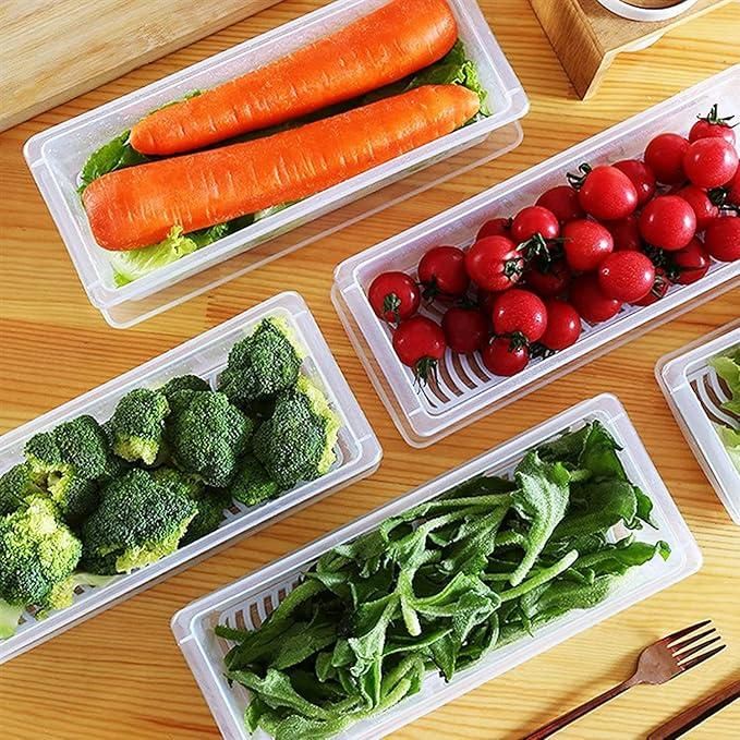 The Gir Farmer fridge storage containers set with fresh carrots cherry tomatoes broccoli and leafy greens on wooden table