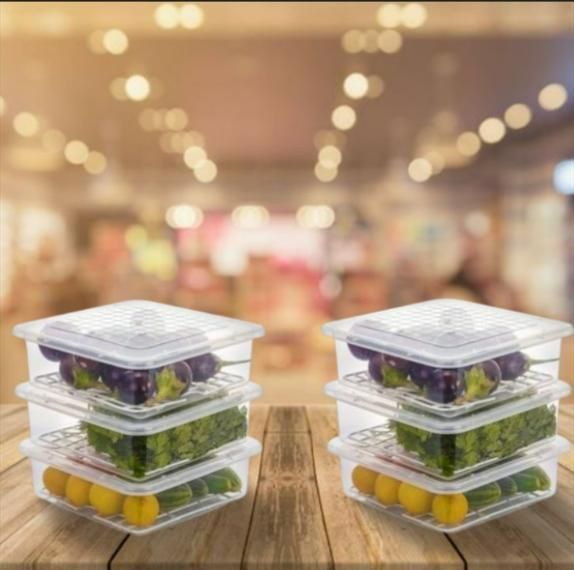 The Gir Farmer clear fridge storage containers set with lids stacked holding fruits and vegetables