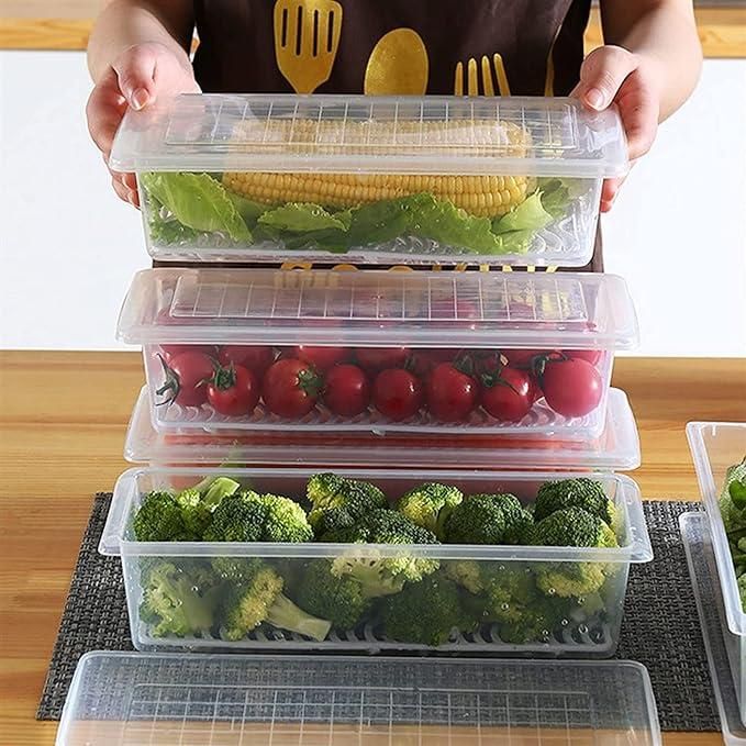 The Gir Farmer fridge storage containers set with clear plastic boxes holding corn, cherry tomatoes, and broccoli