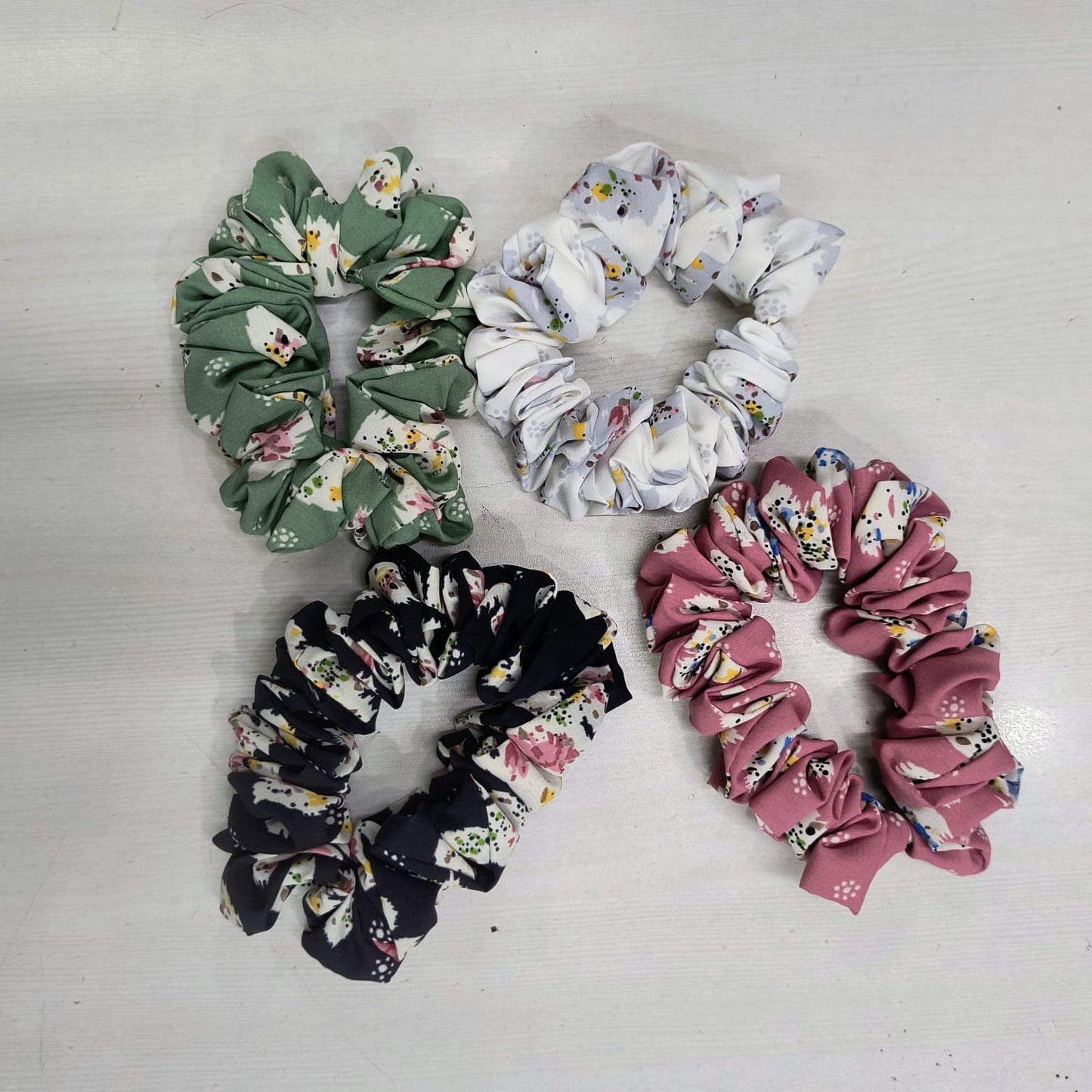 Set of four gentle elastic hair rope for women in green white black and pink floral patterns