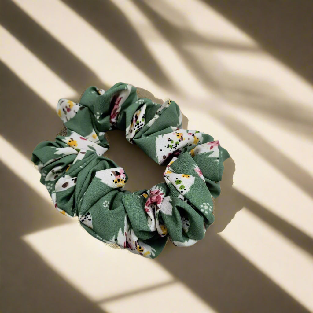 Gentle elastic hair rope for women in green floral fabric with soft ruffled design