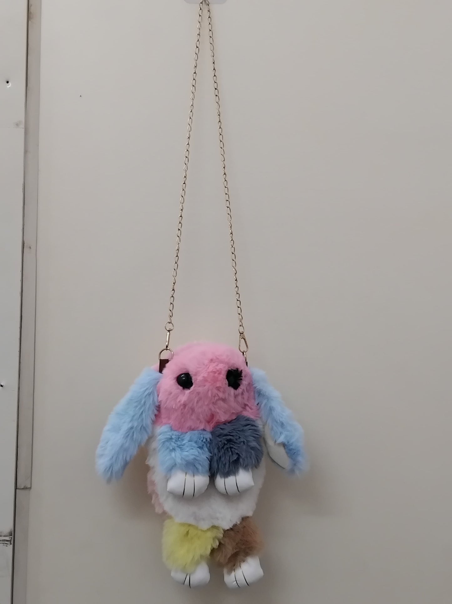 Girls bunny shaped sling bag with chain in pastel colors featuring fluffy texture and cute design